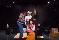 a group of women standing on a stage