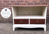 a white and brown tv stand with drawers