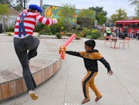 a young boy is playing with a toy