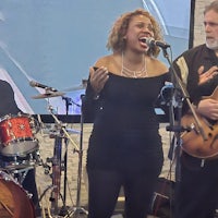 a man and a woman singing into a microphone