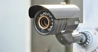 a cctv camera is mounted on a wall