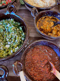 several bowls of food on a table
