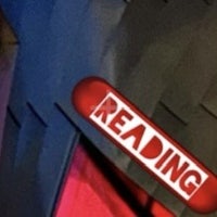 a sign with the word reading on it