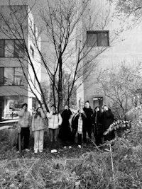 a group of people standing in front of a building
