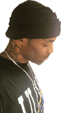 a man wearing a black t - shirt and a beanie