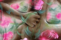 a digital painting of a woman holding a bouquet of roses