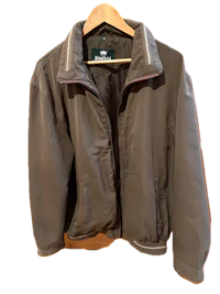 a brown jacket hanging on a hanger