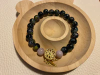 a bracelet with a teddy bear on it