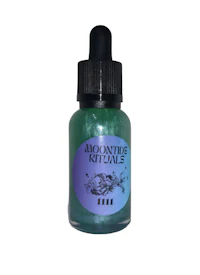 a bottle of green liquid with a purple label