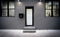 a building with a black door and black windows