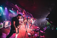 a band performs on stage at a concert