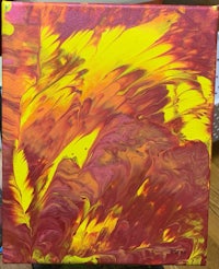 a red and yellow painting on a table
