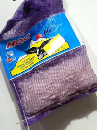 a bag of purple rice sitting on top of a table