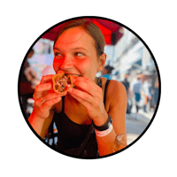 a woman is eating a donut