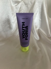 a tube of youth forta on a white cloth