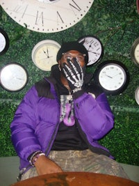 a man wearing a purple jacket