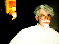 a man with glasses and a mustache