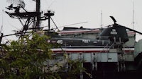 a helicopter sits on top of a ship