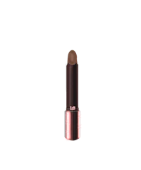 a brown lipstick on a black background