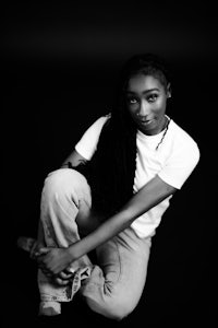 a black and white photo of a woman posing