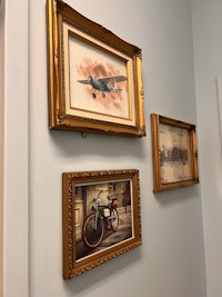 three framed pictures on a wall