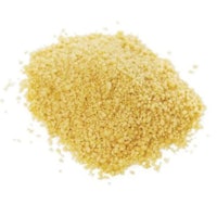 a pile of yellow granulated sugar on a white background