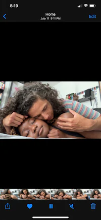 a picture of a woman hugging another woman