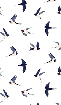 a flock of birds flying in the sky