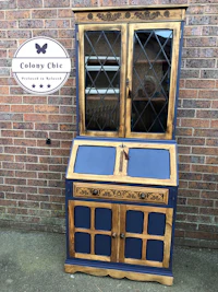 a blue and white china cabinet with a blue door