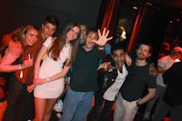 a group of people posing for a picture at a party