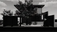 a black and white image of a house with a tree