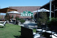 a brick building with a green roof