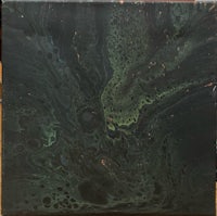 a black and green marble painting on a table