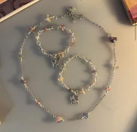 a set of bracelets and charms on a table