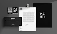 a black and white stationery set with a black envelope