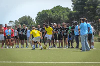 a group of people on a soccer field