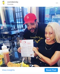 a man and woman posing for a picture at a restaurant