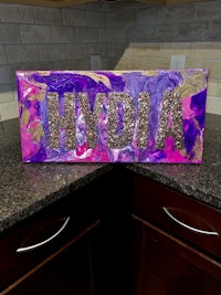 the word hydia is painted on a kitchen counter