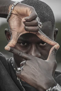 a man is holding his hands up to make a frame