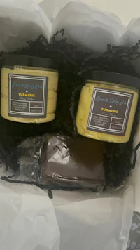two jars of soap in a gift box