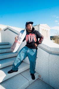 a man holding a skateboard