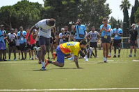 a group of people playing a game of frisbee
