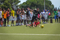 a group of people playing a game of soccer on a field