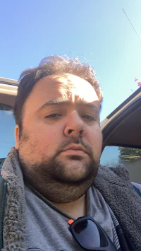a man is sitting in a car