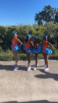 a group of cheerleaders posing for a picture