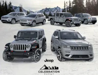 a group of jeeps are parked in the snow