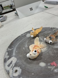 a group of goldfish sitting on a table