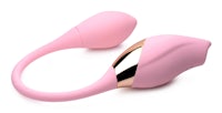 a pink and gold vibrator on a white surface