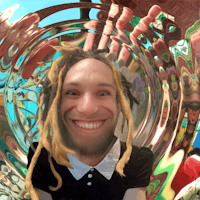 a man with dreadlocks in a circular frame
