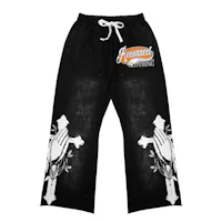 a black and white sweatpants with an image of a cross